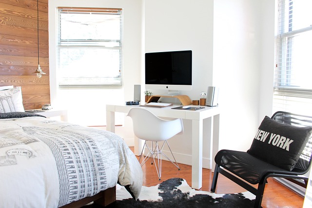 calm bedroom with linen bedding, bedside lamp, and minimal wardrobe organization